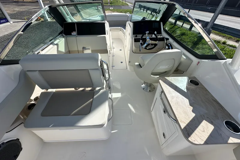 Slide: The Image of Interior of 2026 Boston Whaler 240 Vantage with helm and seating area. - 32