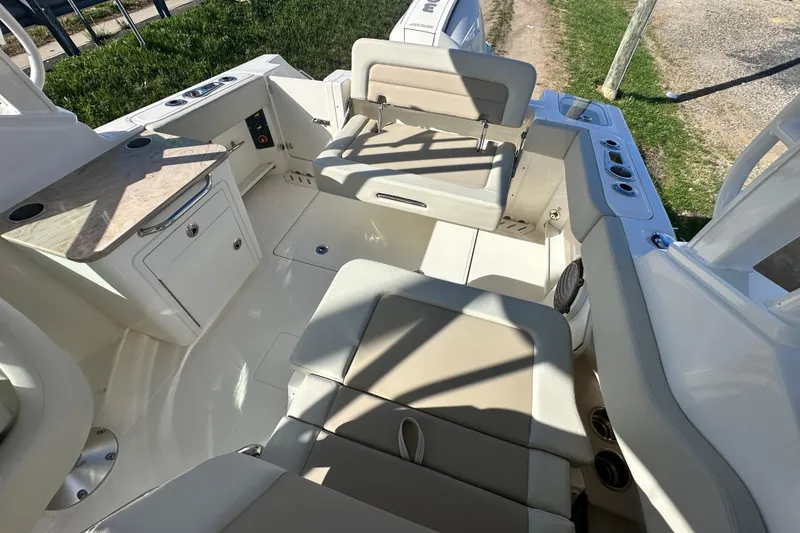 Slide: The Image of Interior of 2026 Boston Whaler 240 Vantage with seating and storage area. - 39