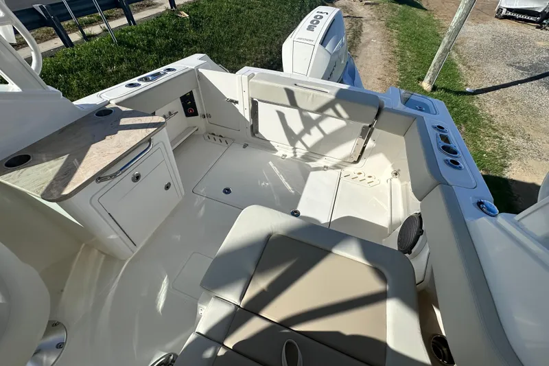 Slide: The Image of Interior of 2026 Boston Whaler 240 Vantage with seating and storage area. - 40