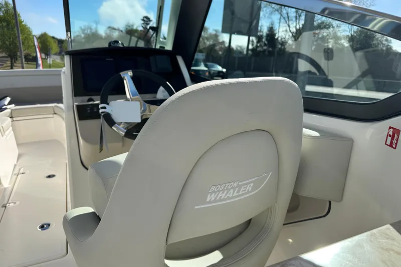 Slide: The Image of Interior of 2026 Boston Whaler 240 Vantage with helm console. - 44