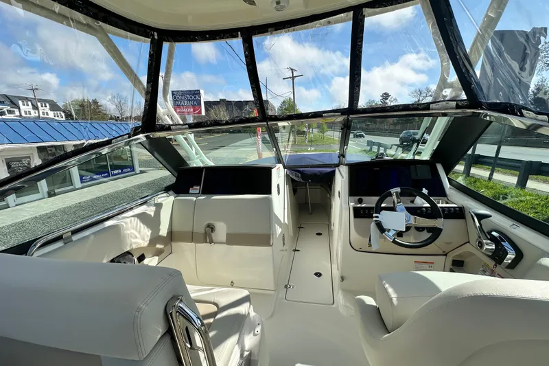 Slide: The Image of Interior of 2026 Boston Whaler 240 Vantage with modern helm console. - 47