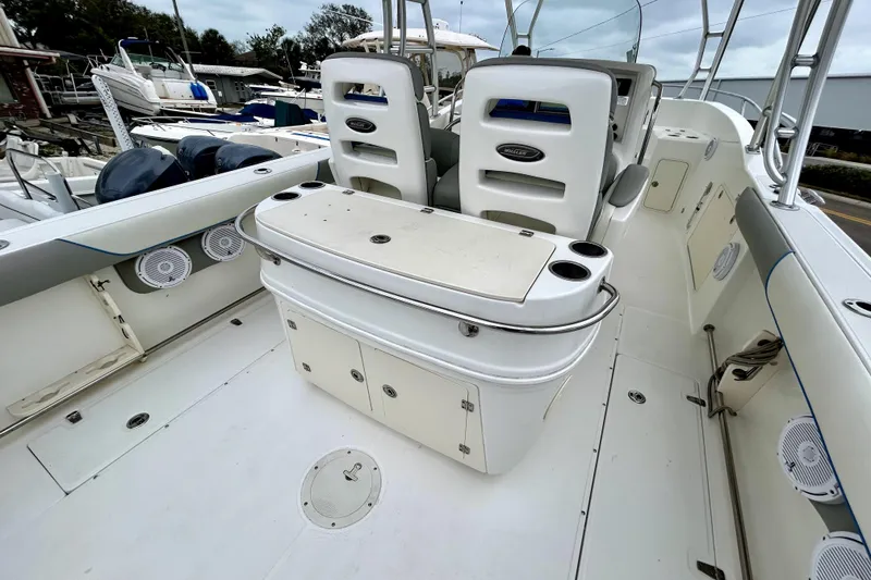 Slide: The Image of 2008 Boston Whaler 320 Outrage Cuddy Cabin boat interior with seating and storage. - 11