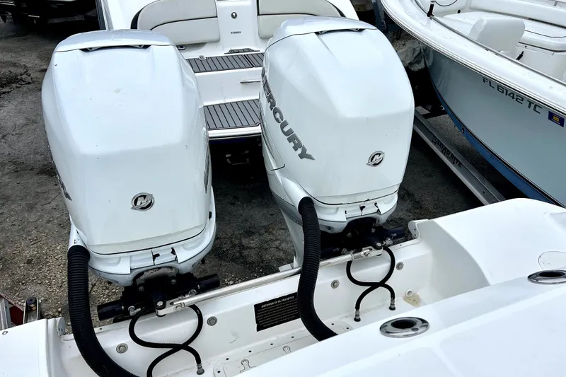 Slide: The Image of Twin Mercury outboard engines on a 2008 Boston Whaler 320 Outrage Cuddy Cabin boat. - 14