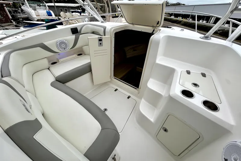 Slide: The Image of 2008 Boston Whaler 320 Outrage Cuddy Cabin interior with seating and storage compartments. - 5