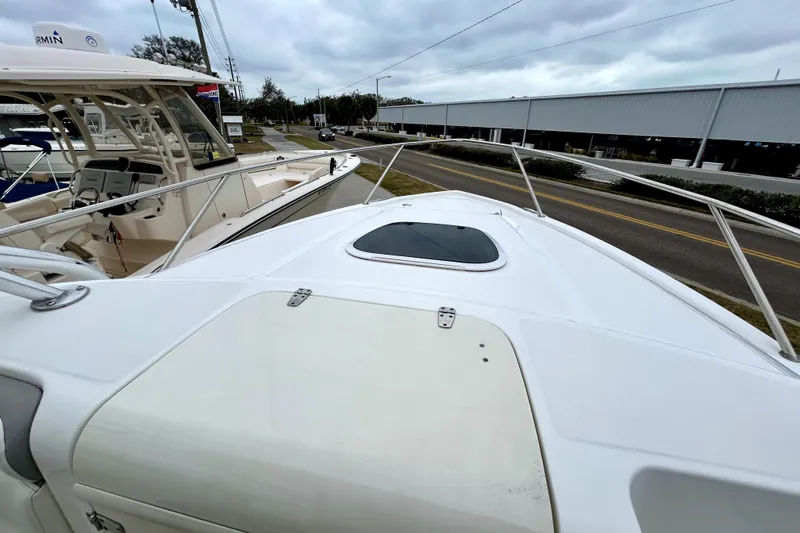 Slide: The Image of 2008 Boston Whaler 320 Outrage Cuddy Cabin, docked with overcast sky. - 6