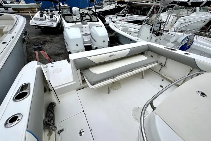 Slide: The Image of 2008 Boston Whaler 320 Outrage Cuddy Cabin, spacious deck with seating and storage. - 9