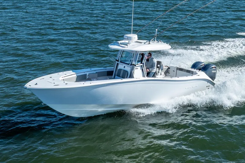 The Image of 2021 Cape Horn 32 XS boat cruising on open water, showcasing sleek design and powerful engines. - 0