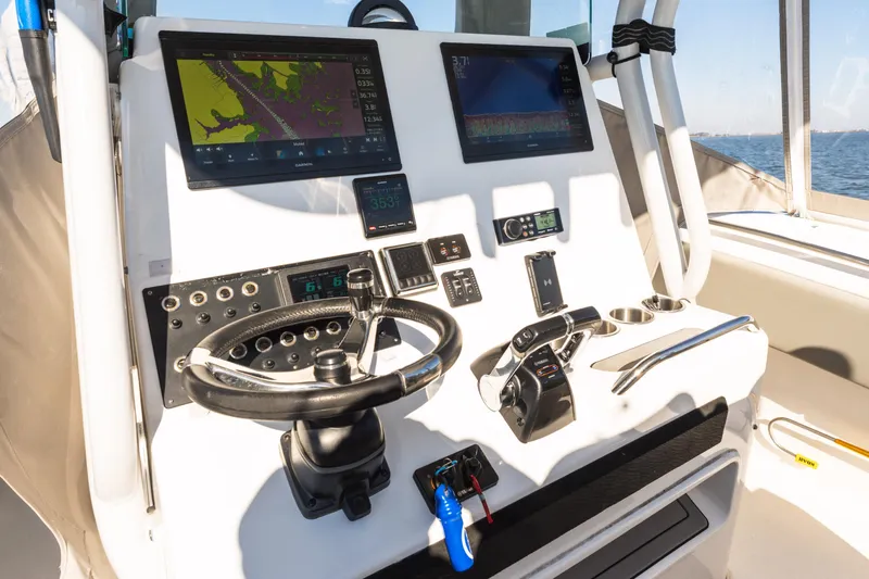 Slide: The Image of Cockpit of 2021 Cape Horn 32 XS boat with advanced navigation displays. - 8