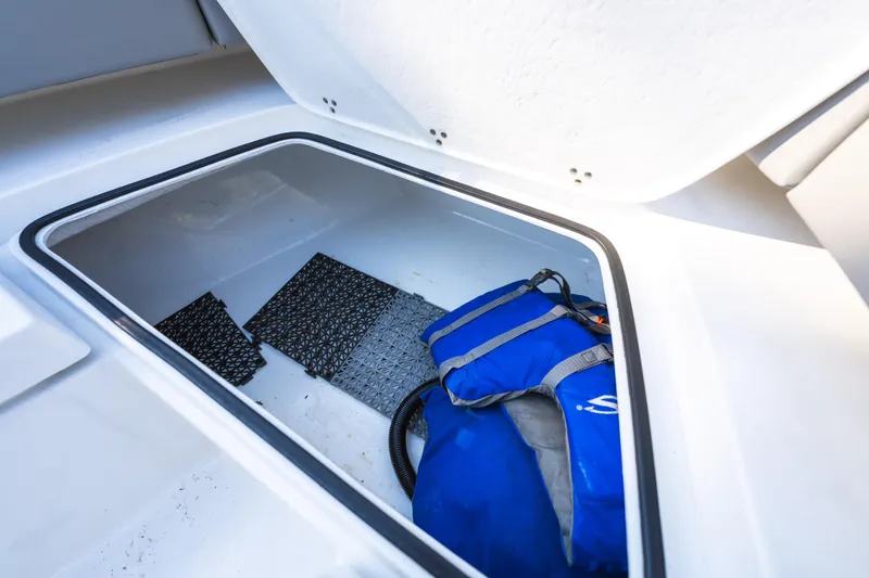 Slide: The Image of Storage compartment in 2021 Cape Horn 32 XS boat with life jacket and mats. - 19