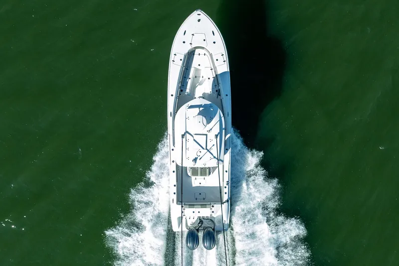 Slide: The Image of Aerial view of 2021 Cape Horn 32 XS boat cruising on green water. - 5