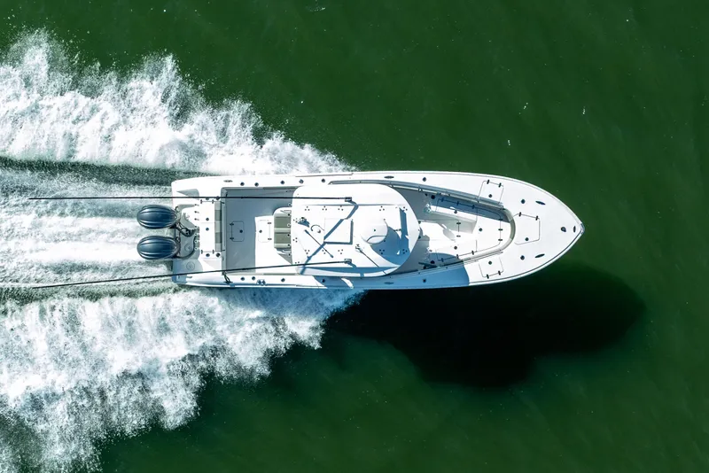 Slide: The Image of Aerial view of 2021 Cape Horn 32 XS boat cruising on water. - 7