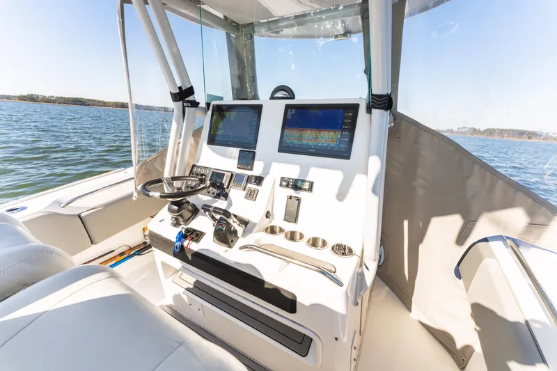 Slide: The Image of 2021 Cape Horn 32 XS boat cockpit with modern navigation equipment on a sunny day. - 9