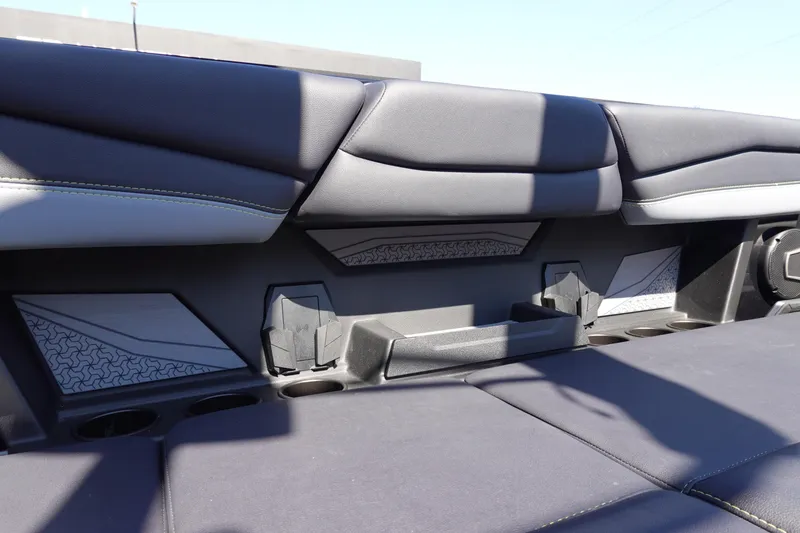 Slide: The Image of Interior of 2026 Axis A245 boat with sleek seating and cup holders. - 14