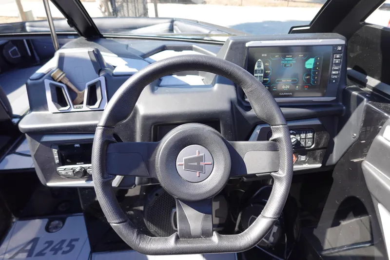 Slide: The Image of 2026 Axis A245 boat dashboard with steering wheel and digital display. - 17