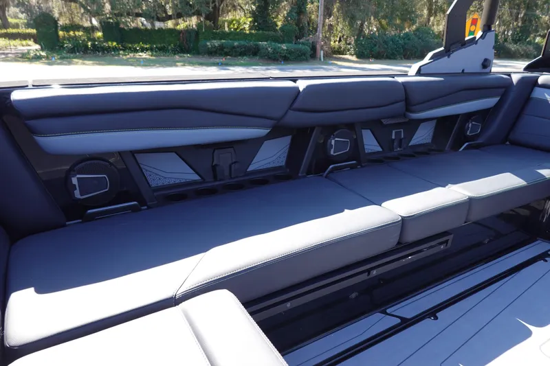 Slide: The Image of 2026 Axis A245 boat interior with sleek, modern seating and integrated speakers. - 22