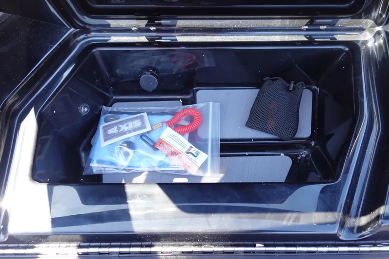 Slide: The Image of 2026 Axis A245 storage compartment with accessories and safety gear. - 31