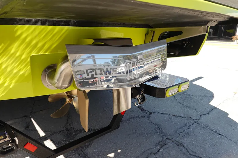 Slide: The Image of 2026 Axis A245 boat stern with propeller and Power Wedge III, lime green finish. - 7