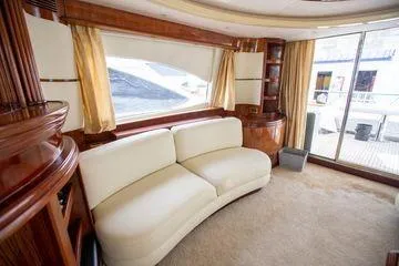 Slide: The Image of Luxurious interior of 2003 Azimut 74 Solar yacht with elegant seating and large windows. - 4
