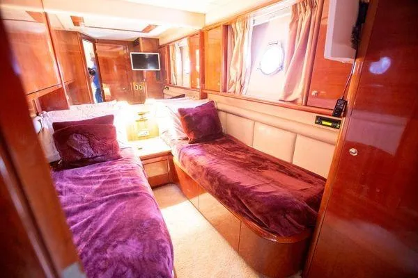 Slide: The Image of Luxurious cabin interior of 2003 Azimut 74 Solar yacht with twin beds and rich wood finish. - 9