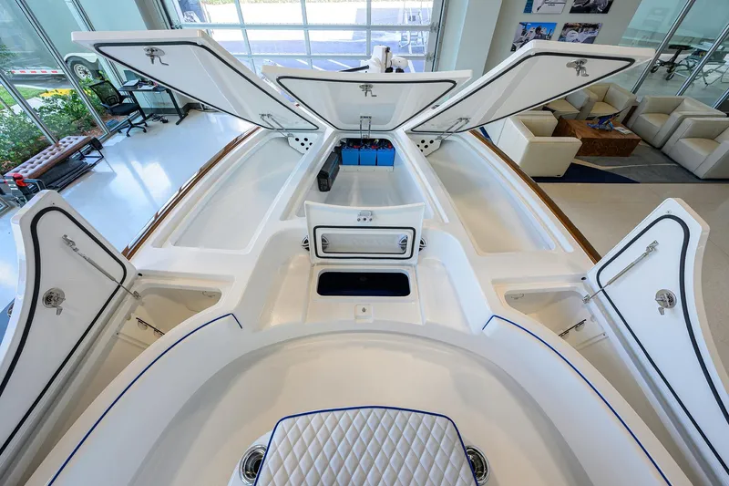 Slide: The Image of 2026 Valhalla Boatworks V-28 Bay interior with open storage compartments in showroom. - 14