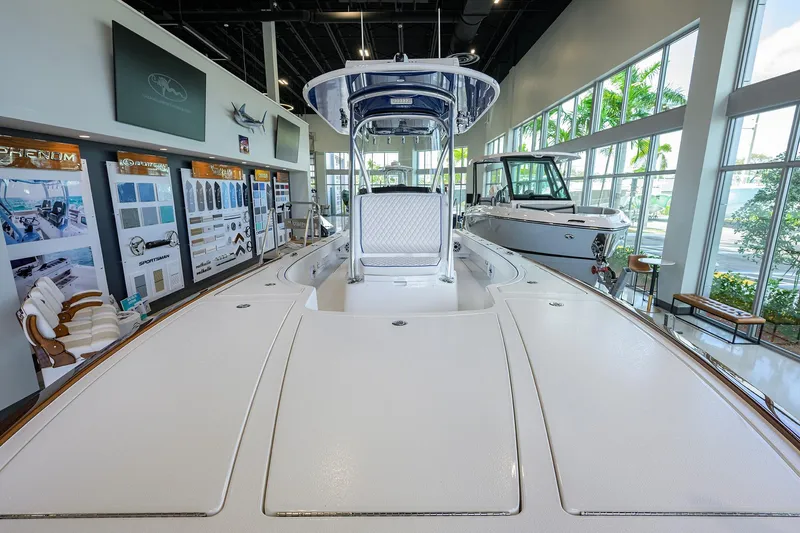 Slide: The Image of 2026 Valhalla Boatworks V-28 Bay displayed in a modern showroom setting. - 16