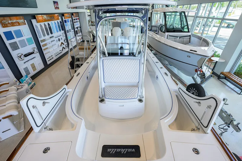 Slide: The Image of 2026 Valhalla Boatworks V-28 Bay displayed in showroom, featuring sleek design and modern amenities. - 17