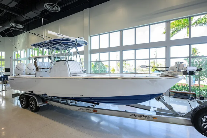 Slide: The Image of 2026 Valhalla Boatworks V-28 Bay displayed indoors on a trailer. - 2