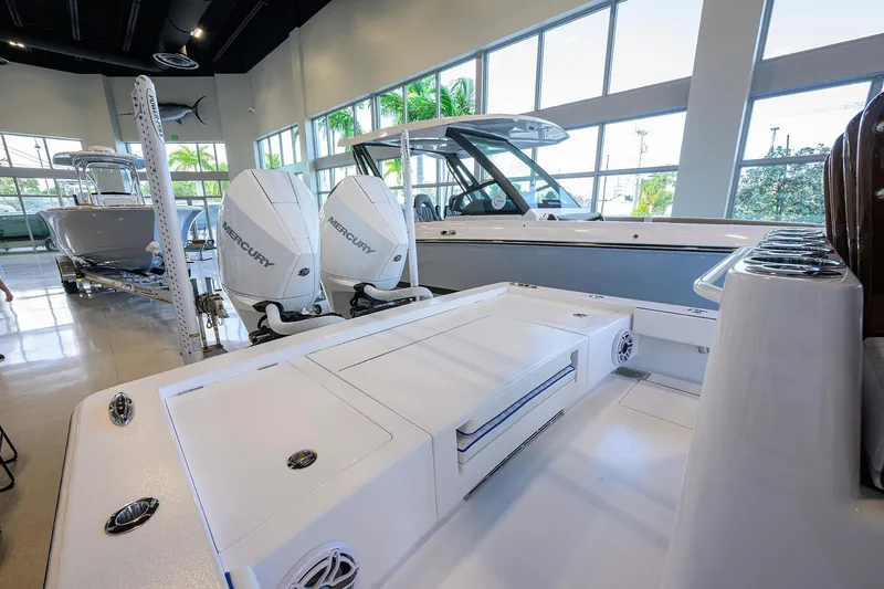 Slide: The Image of 2026 Valhalla Boatworks V-28 Bay with dual Mercury engines in showroom. - 23