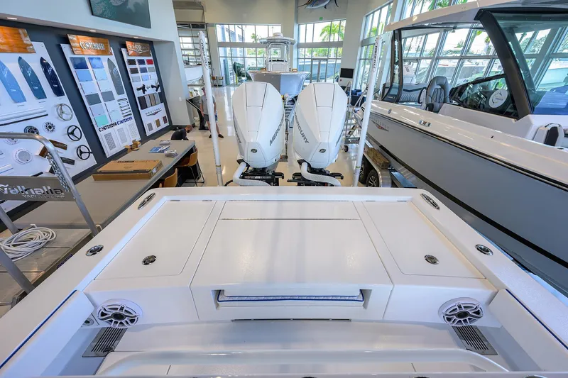 Slide: The Image of 2026 Valhalla Boatworks V-28 Bay in showroom, featuring dual Mercury engines. - 24
