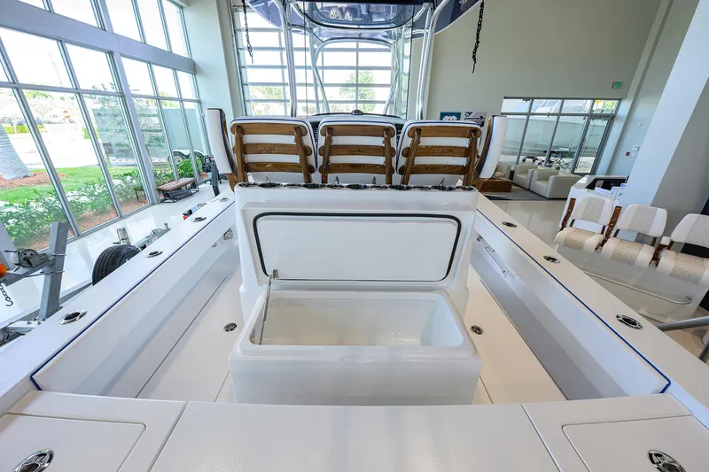 Slide: The Image of 2026 Valhalla Boatworks V-28 Bay interior with seating and storage, showroom display. - 29