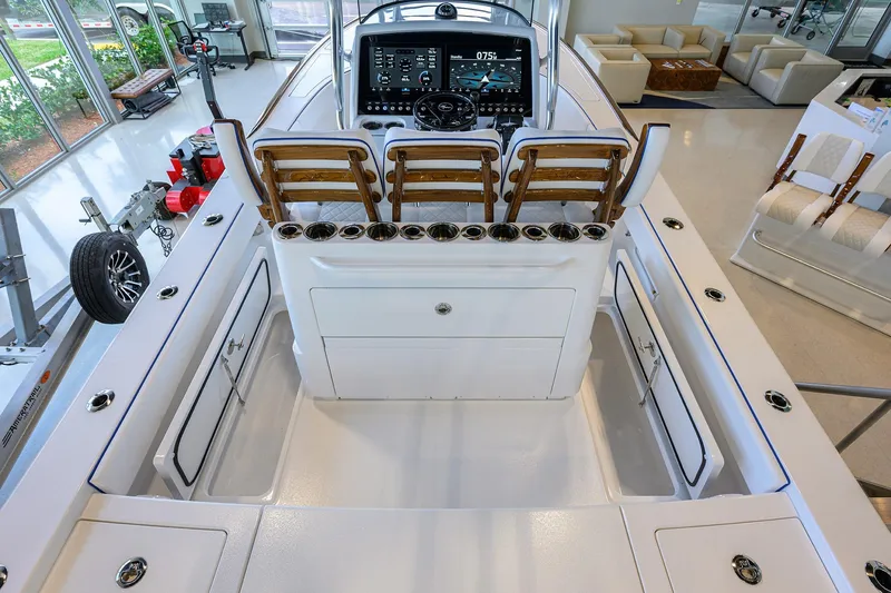 Slide: The Image of 2026 Valhalla Boatworks V-28 Bay interior with helm, seating, and storage compartments. - 30