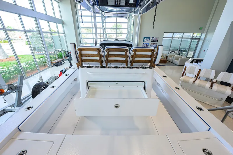Slide: The Image of 2026 Valhalla Boatworks V-28 Bay interior with seating and storage in showroom. - 32