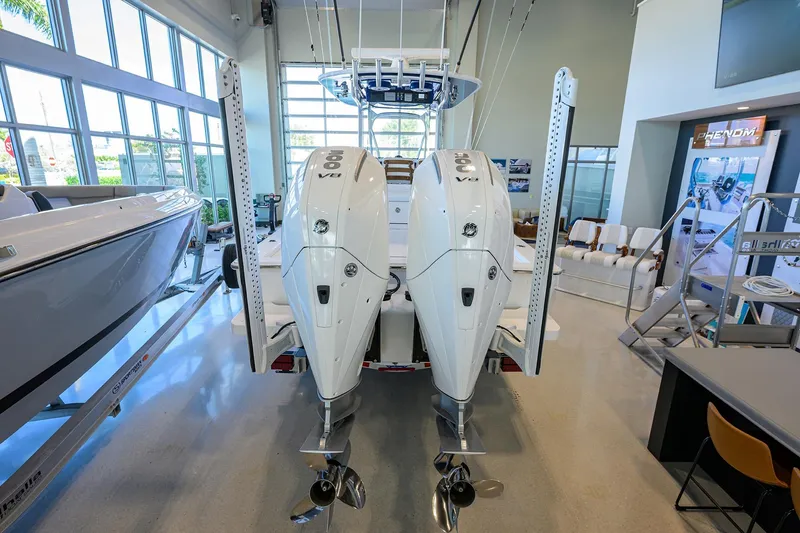 Slide: The Image of 2026 Valhalla Boatworks V-28 Bay with dual outboard engines in showroom. - 7