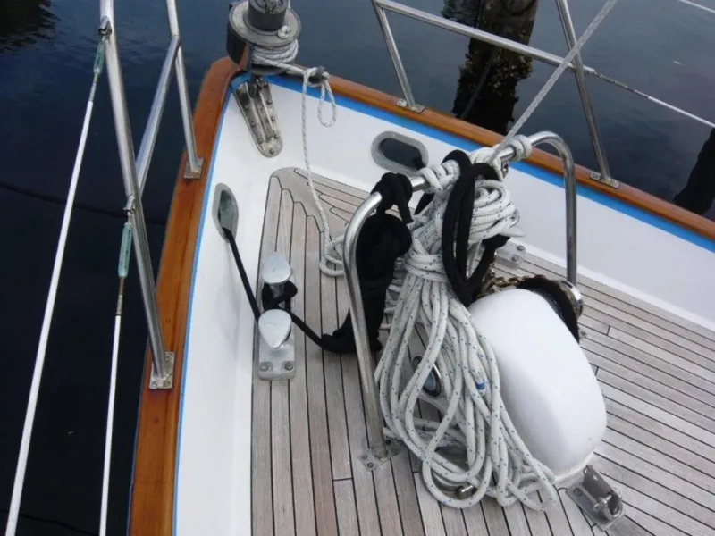 Slide: The Image of Deck of 1990 Cheoy Lee Sloop with ropes and railing. - 13