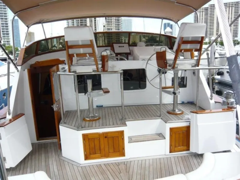 Slide: The Image of 1990 Cheoy Lee Sloop cockpit with dual helm stations and wooden accents. - 16