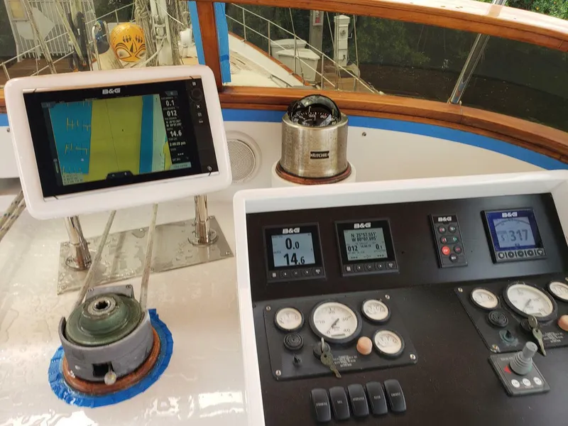 Slide: The Image of Cockpit of 1990 Cheoy Lee Sloop with navigation instruments and controls. - 22