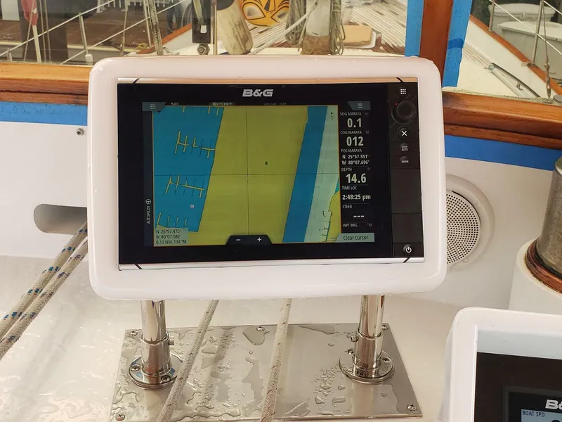 Slide: The Image of Navigation system on 1990 Cheoy Lee Sloop, displaying nautical charts and data. - 23
