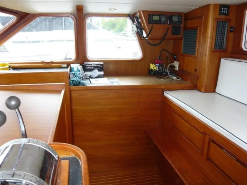 Slide: The Image of Interior of 1990 Cheoy Lee Sloop with wooden finish and navigation equipment. - 28