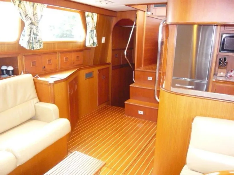 Slide: The Image of Interior of 1990 Cheoy Lee Sloop with wooden finish and comfortable seating. - 41