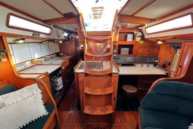 Slide: The Image of Interior of 1988 Hylas Custom 44 yacht with wood finish and modern amenities. - 3