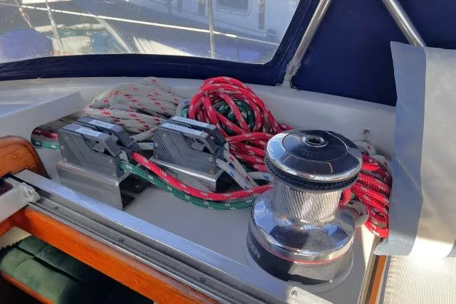 Slide: The Image of Winch and ropes on 1988 Hylas Custom 44 sailboat deck. - 31