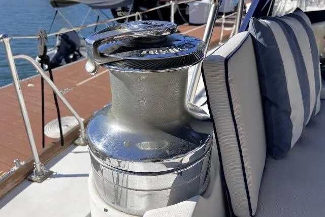 Slide: The Image of Winch on 1988 Hylas Custom 44 yacht deck with striped cushions. - 32