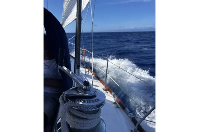 Slide: The Image of Sailing on a 1988 Hylas Custom 44 yacht in open ocean waters. - 44