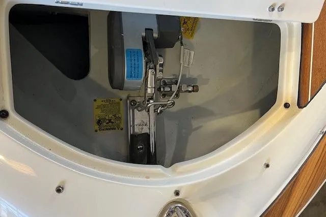 Slide: The Image of 2021 Chris-Craft Launch 27 engine compartment detail with mechanical components visible. - 19