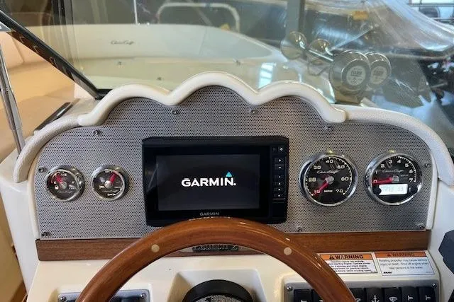 Slide: The Image of 2021 Chris-Craft Launch 27 dashboard with Garmin display and classic gauges. - 20