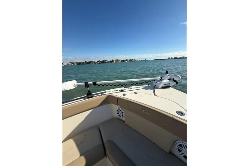 Slide: The Image of 2024 Scout 240 XSF boat on water, featuring a sleek design and modern equipment. - 17