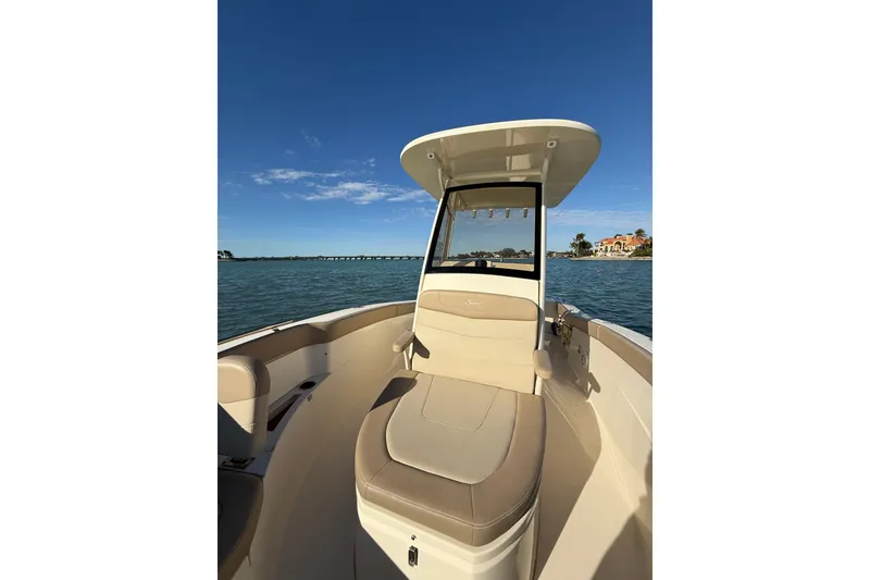 Slide: The Image of 2024 Scout 240 XSF boat on water, featuring sleek design and comfortable seating. - 18