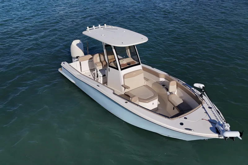 Slide: The Image of 2024 Scout 240 XSF boat on calm water, featuring sleek design and modern amenities. - 5