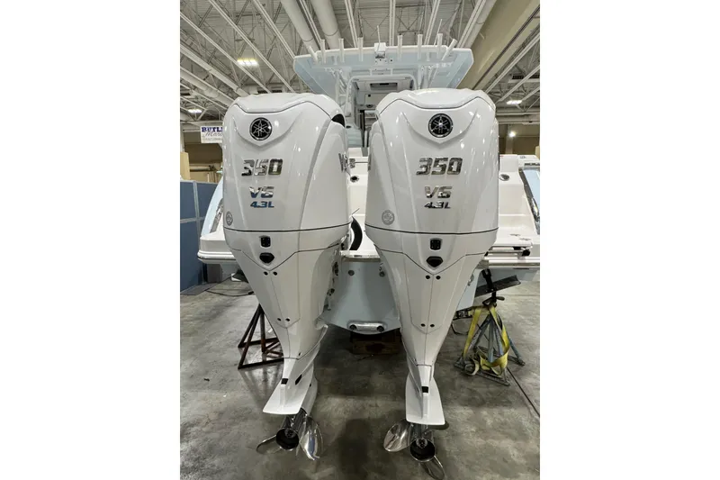 Slide: The Image of 2026 Robalo R300 Center Console with twin 350 V6 4.3L outboard engines. - 1