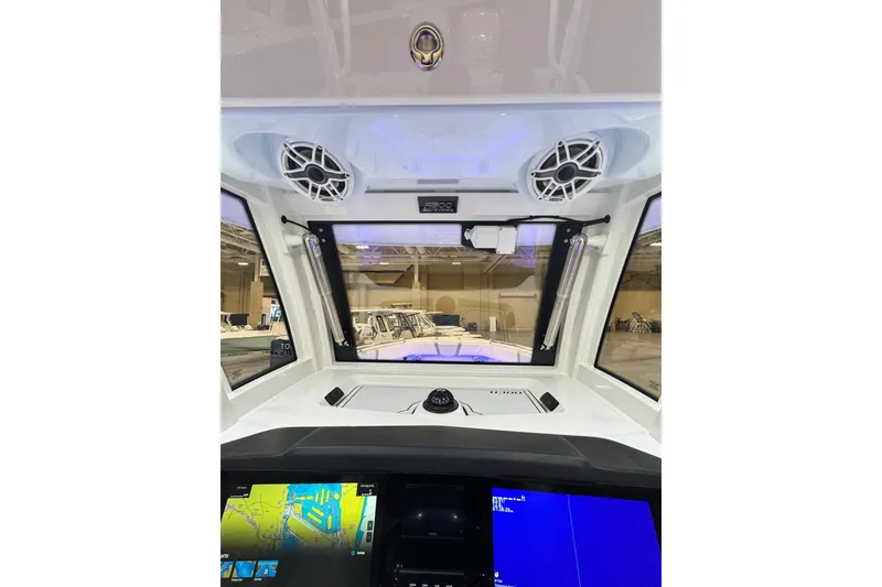 Slide: The Image of 2026 Robalo R300 Center Console dashboard with advanced navigation and audio system. - 12